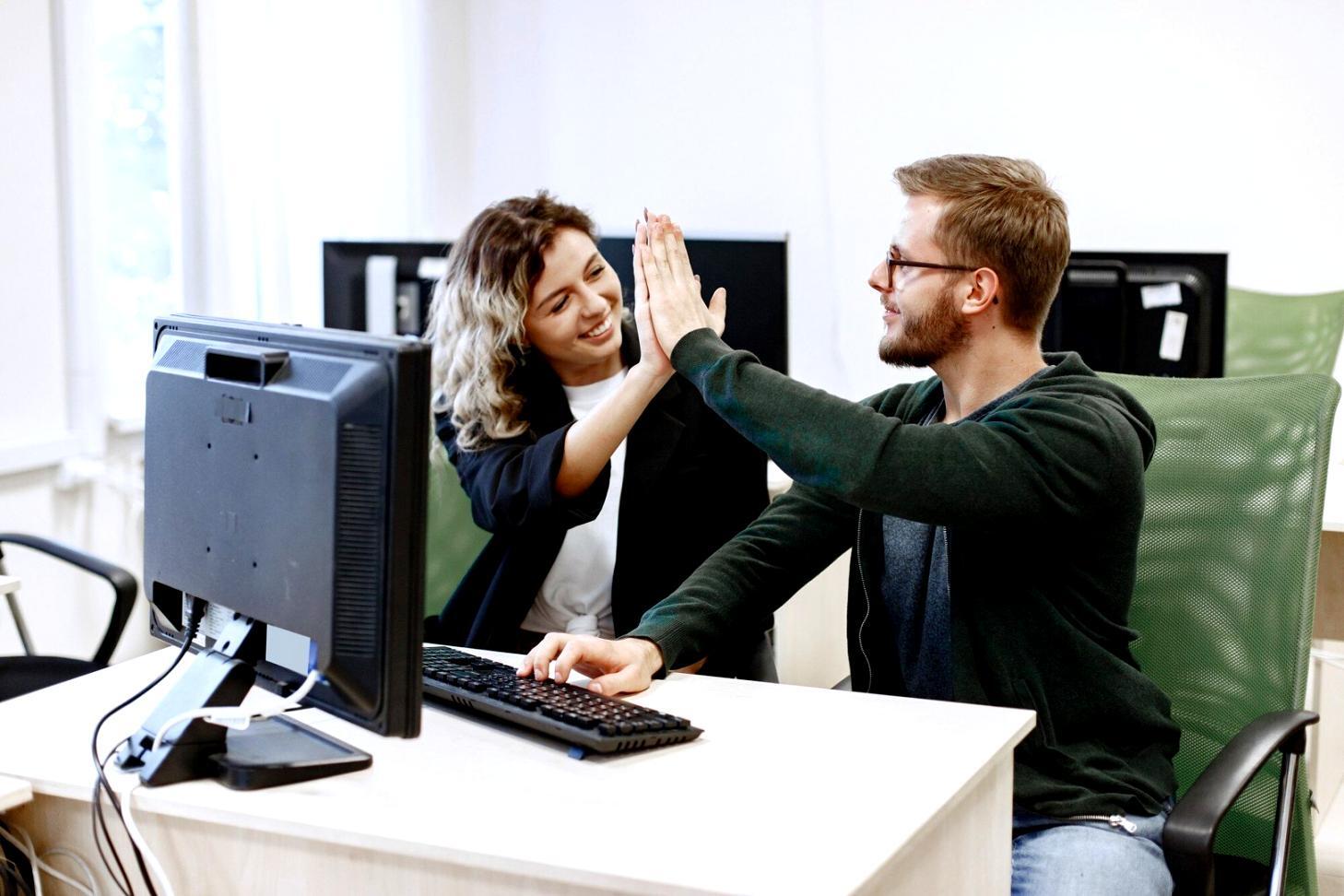 Student working with professional audio equipment in sound design studio